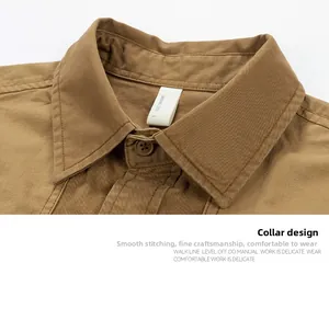 Detailed macro view of khaki shirt collar with clean stitching and size tag L