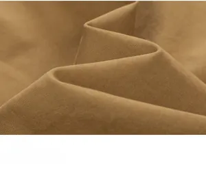Macro shot of khaki twill fabric texture and high-density weaving on the shirt sleeves