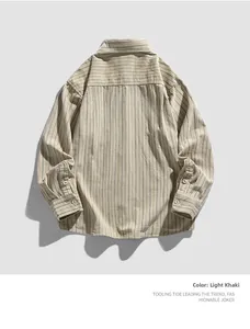 Detail view of light khaki workwear shirt with fine stripes and shoulder yoke back design