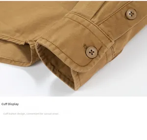 Detail of khaki twill cotton cuff with double stitching and tonal resin button