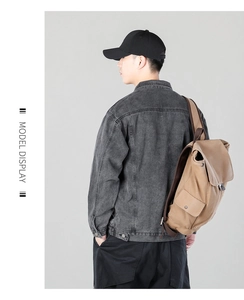 Model display of a retro khaki canvas backpack with flap closure and side pockets