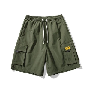 Detail of army green cargo shorts featuring elastic waist, white drawstring and side pockets