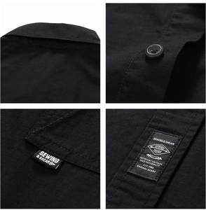 Detail of black ripstop workwear shirt with woven labels and resin buttons