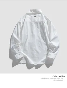 Close-up of white cotton shirt cuff with double buttons and fine fabric texture