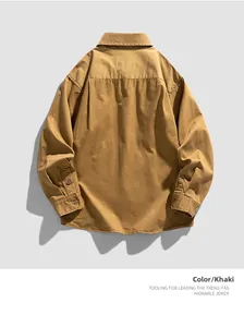 Detail view of khaki workwear shirt back with thick cotton texture and yoke design