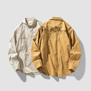 Long-sleeved cotton shirts with ethnic embroidery on pocket and back in beige and yellow