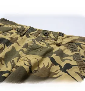 Close-up of waist button closure and camo print detail on these cargo shorts for men
