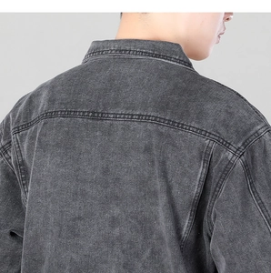 Close-up of the washed grey denim jacket back showing high-quality stitching and texture
