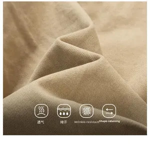 Detail of khaki cotton twill fabric showing breathable, moisture-wicking and anti-wrinkle texture