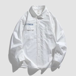Flat lay of white cotton long-sleeve shirt with double chest pockets and graphic print