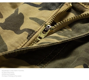 Macro detail of high-quality metal zipper and camo fabric on mens cargo shorts
