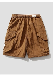 Detailed close-up of brown cargo shorts featuring cargo pockets and drawstring waistband