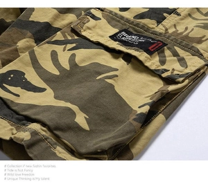 Detail of cargo short pocket with camouflage pattern and woven brand label