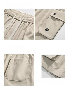 Detail of khaki cargo shorts showing elastic drawstring waist and side pockets with button