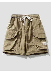 Detail of cargo shorts waist with white drawstring and elastic band in khaki color