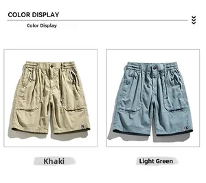 Detail view of khaki and light green cargo shorts with elastic drawstring waist and pockets