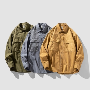 Classic cotton long-sleeved work shirts in army green, grey-blue, and ginger yellow colors