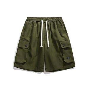 Detailed view of cargo shorts with elastic drawstring waist and large flap utility pockets