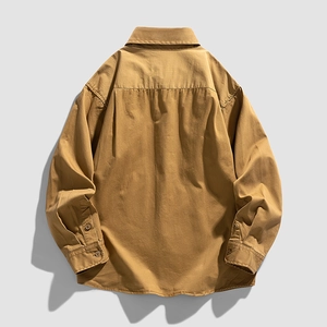 Khaki long-sleeve shirt for women featuring a back box pleat and curved hemline