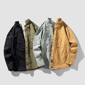 Classic long-sleeved button-up shirts in black, olive green, light blue, and mustard yellow