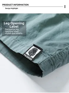 Close-up of cargo shorts cuff featuring a black fashion fabric label on olive cotton fabric