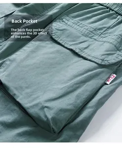 Detail of cargo pants flap pocket with double-needle stitching and red brand tag