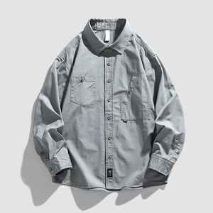 Men's dark grey long sleeve casual shirt with dual chest pockets and button-down collar
