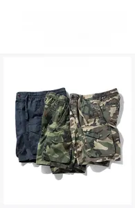 Detailed flat lay of men's cargo camouflage shorts in navy, green, and brown cotton