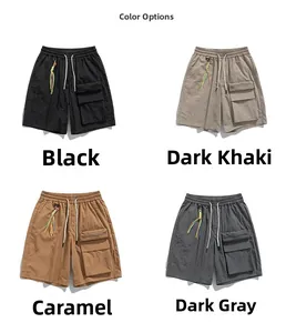 Detail view of multi-pocket cargo shorts in black, khaki, caramel, and grey tech fabric