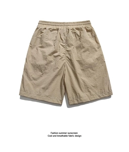 Detail of khaki men's casual shorts with elastic drawstring waist and breathable fabric