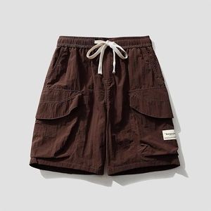 Men's loose cargo shorts in dark coffee with elastic drawstring waist and side flap pockets