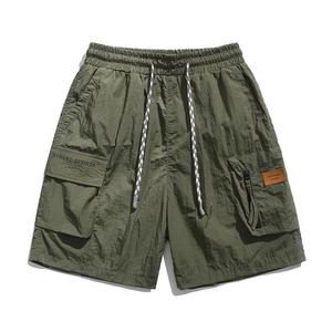 Men's olive green cargo shorts with elastic drawstring waist and side utility pockets