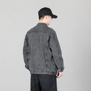 Men's washed charcoal grey denim jacket with a loose fit and workwear back stitching