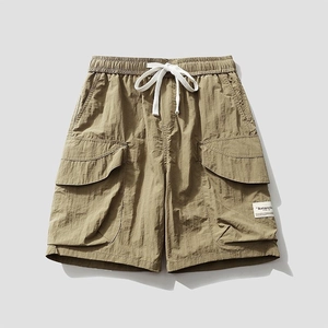 Men's casual cargo shorts in khaki with elastic drawstring waist and large flap pockets