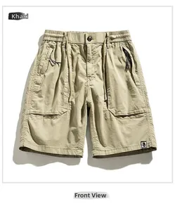 Detailed front view of khaki cargo shorts showing drawstring waist and zipper pockets