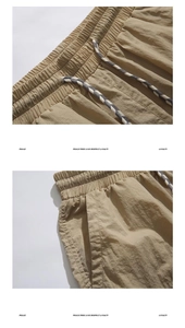 Detail of khaki cargo shorts with elastic drawstring waist and ripstop checkered fabric