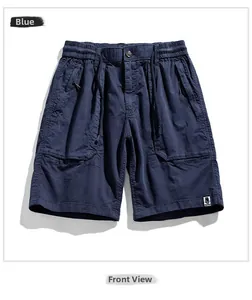 Detail of navy blue cargo shorts featuring a drawstring waist and fashion logo patch