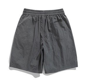 Rear view of dark grey ice silk cargo shorts showing elastic waist and back pocket detail