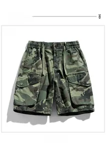 Detailed view of army green camo cargo shorts with elastic drawstring waist and side pockets
