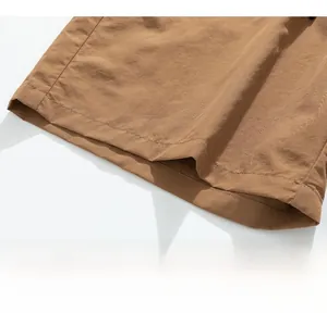 Detailed close-up showing the precise stitching and hem of brown ice silk cargo shorts