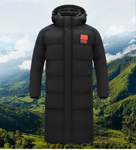 Detail of hooded long quilted parka in black with national flag patch on the chest