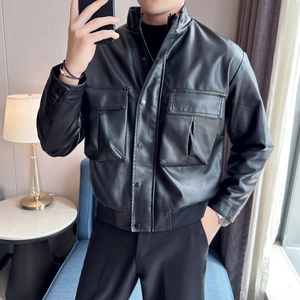 Detail view of men's black PU leather jacket featuring large front pockets and stand collar