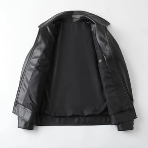 Detailed view of black faux leather jacket with smooth inner lining and durable zipper