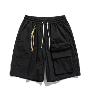 Black ice silk cargo shorts with elastic waist and large zipper pocket in street style
