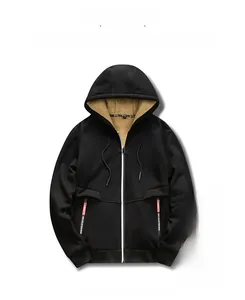 Detail view of men's black zip-up hoodie featuring thick beige faux lamb wool lining