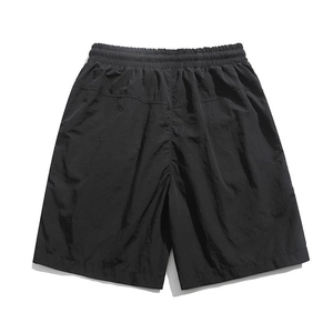 Men's casual loose cargo shorts in black with elastic waist and structural seam detailing
