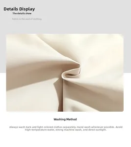 Detail of cream fabric texture with washing instructions for men's padded jacket