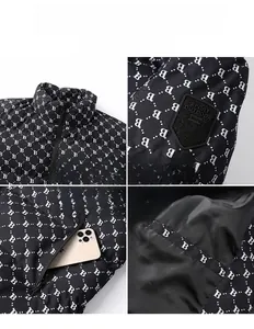 Detail of black hooded winter vest featuring white monogram print and sport badge