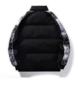 Rear view of black puffer jacket with graffiti patterned tape on sleeves and stand collar