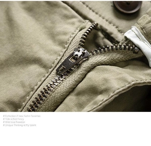 Detail of metal zipper and khaki twill fabric on Japanese style cargo shorts